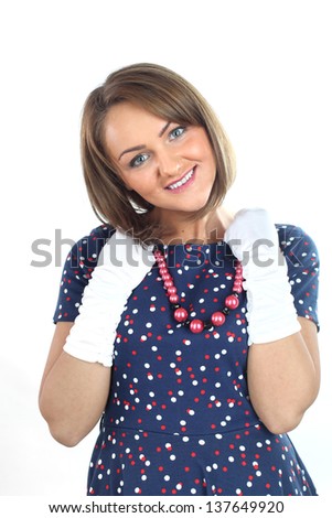 Lovely woman wearing a dress with polka dots and a new red jewel