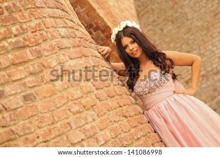 Beautiful  young princess woman in the city. .Fantasy dress.