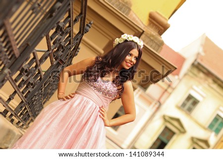 Beautiful  young princess woman in the city. .Fantasy dress.