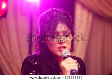 Beautiful woman sings at event
