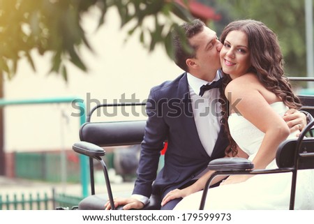 Bride and groom in a carriage
