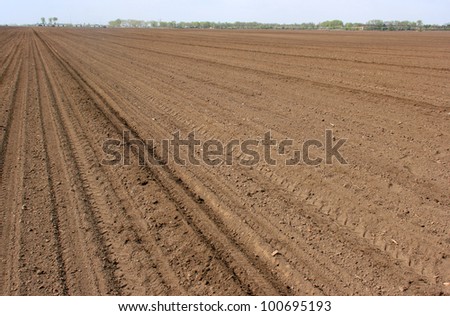 Cultivated soil on sunny day waiting rain to start its job