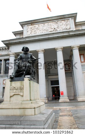 Entrance of Prado museum with monument of Diego Velasquez in front