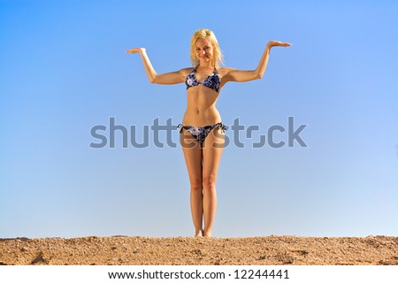 young woman keeps her hands as a balance