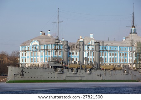 Aurora is a Russian protected cruiser, currently preserved as a museum ship in St. Petersburg. Symbol of the Communist Revolution in Russia. The ship against a building of The Nakhimov Naval School.