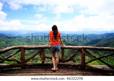 Young woman looking at sky