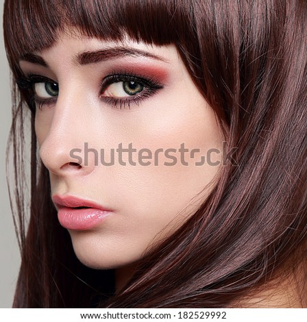 Sexy woman with bright makeup eyes and long lashes. Closeup