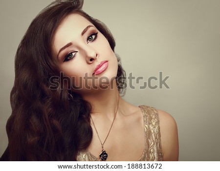 Beautiful smoky eyes makeup woman with long healthy brown hair. Closeup