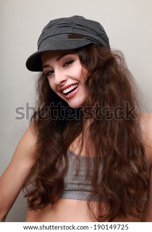 Beautiful smiling female with long hair in hat
