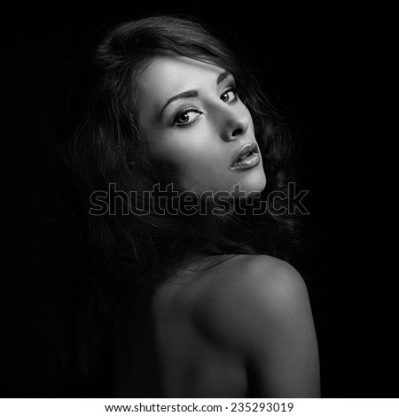 Beautiful dramatic woman face looking. Closeup. Black and white portrait