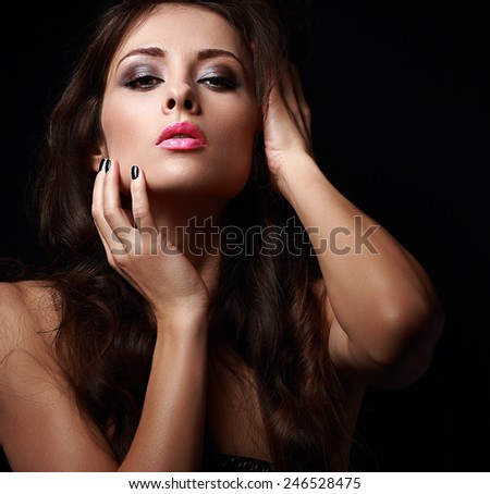 Beautiful passion woman looking hot on black background. Closeup portrait