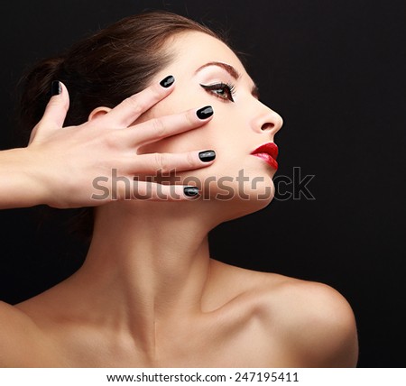 Sexy makeup woman with black nails on face. Woman profile with red lipstick