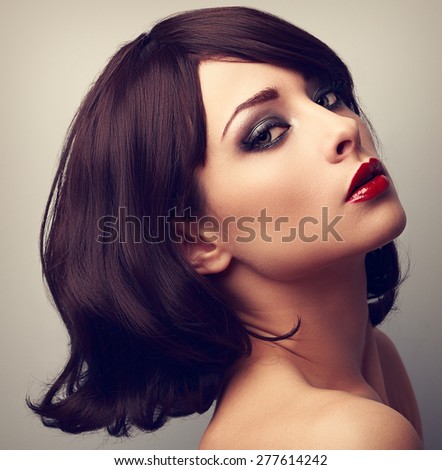 Beautiful makeup profile of black hair style woman. Closeup color vintage portrait