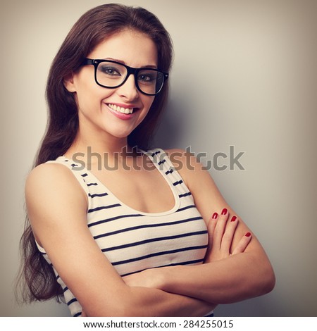 Happy successful young woman in glasses looking. Vintage closeup portrait