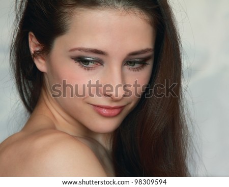 Closeup portrait of romantic thinking naked young woman looking down with long hair