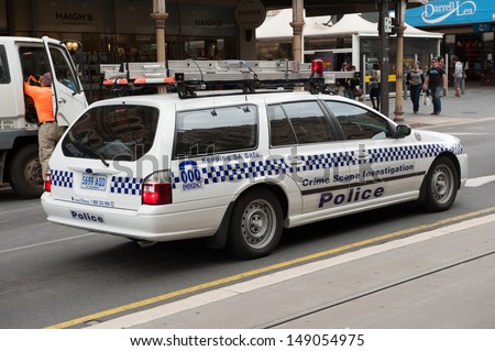 ADELAIDE, AUSTRALIA - OCTOBER 29: South Australian police crime scene investigation unit  on route to perform its duties on 29 October 2011 in the Adelaide city centre.