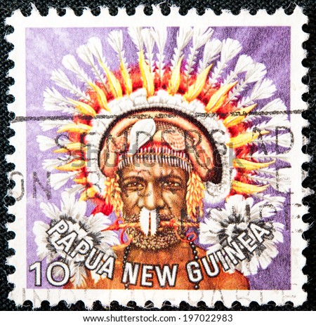 PAPUA NEW GUINEA - CIRCA 1978: A used postage stamp from Papua New Guinea illustrating Native man is tribal dressing, issued in 1978.