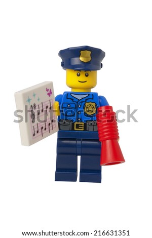 ADELAIDE AUSTRALIA September 11 2014 A studio shot of a Policeman holding carols Lego minifigure from the 2014 Lego Advent Calendar Lego is extremely popular worldwide ADELAIDE AUSTRALIA September 11 2014 A studio shot of a Policeman holding carols Lego minifigure from the 2014 Lego Advent Calendar Lego is extremely popular worldwide