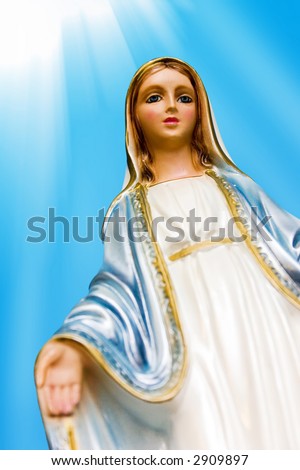 Blessed Virgin Mary. Mother Mary statue with rays of light.