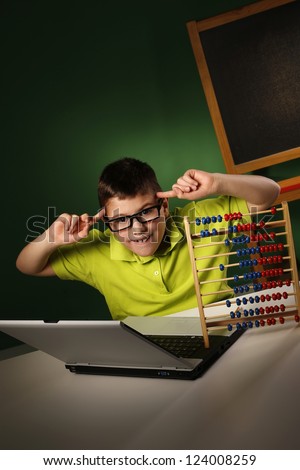 Schoolboy with modern and tradition learning tools