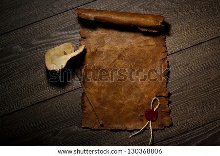 Old letter paper with seal stamp on wooden background