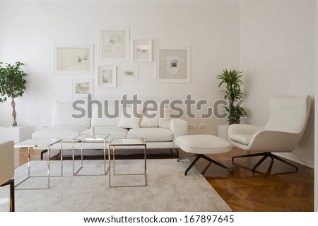 Interior of living room with white furniture