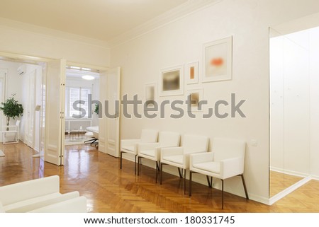 Waiting room with white furniture