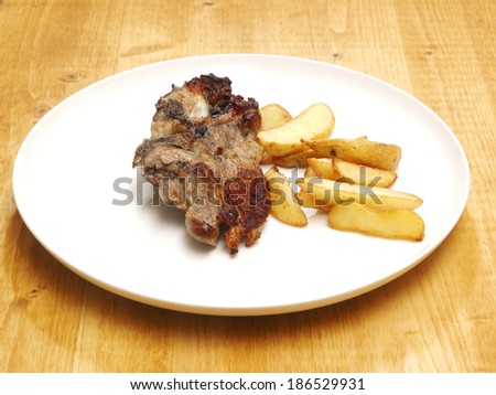 Roasted veal meat with potatoes