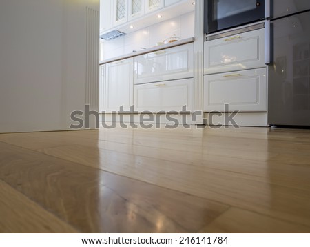 White kitchen and parquet floor