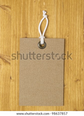 Carton square label on wood background