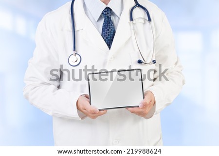 Doctor holding tablet with copy space