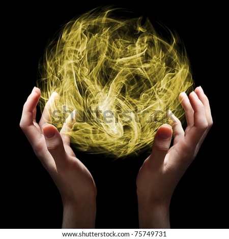 Hands rising a magical orb.