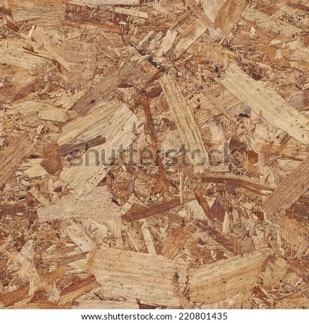 Repeating tileable rough wooden chipboard background. Seamless image that repeats left, right, up and down