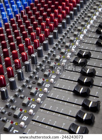 Recording studio audio mixing desk knobs and sliders