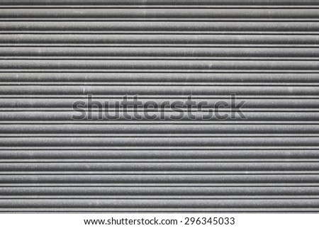 Metal roller shutter door. Security grill background