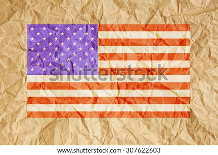 United States of America, USA flag. American flag on crumpled brown paper background.