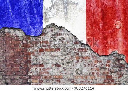 France wall. Grungy old brick wall with French flag on broken render surface