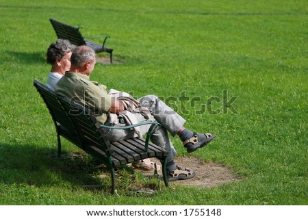 Shot of an old family couple talking in the park