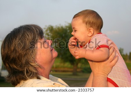 a grandma and baby smiling at each other