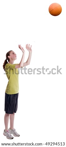 isolated teen age girl throwing a basketball