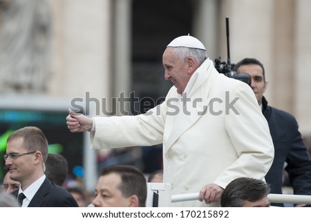 Vatican City - November 27: Pope Francis on the pope mobile bless faithful in St. Peter\'s Square on November 27 2013