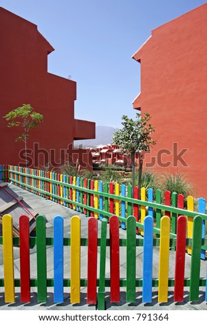 Colourful fence of childrens playground in vacation apartments in Spain