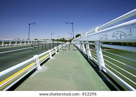 Abstract Bridge over main Guadalquivir river in Seville, southern Spain with converging lines