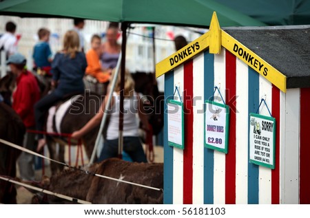 Colourful hut in Weymouth displaying signs for Donkey rides