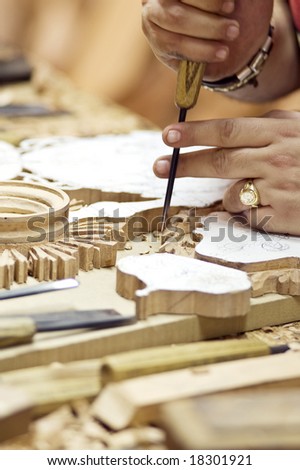 Detail of a craftsman of the wood working on a piece