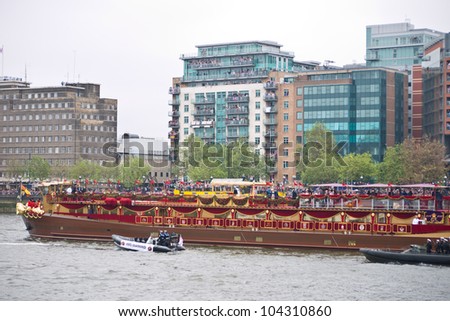 LONDON, UK-JUNE 3: The Spirit of Chartwell the Royal Barge carries the Queen and Royal family in the 1000 strong flotilla in the Diamond Jubilee Pageant on the River Thames.June 3, 2012 in London UK.