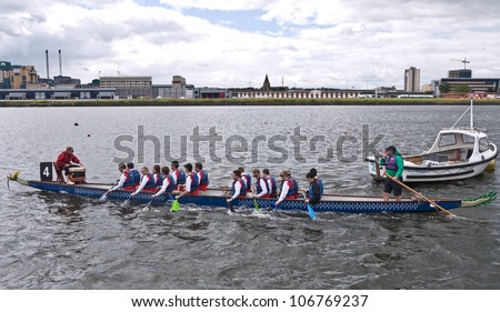 LONDON, UK-JULY 1:  Dragon Boat team members  prepare for their race, in the 17th London Hong Kong Dragon Boat festival at the London Regatta Centre in Docklands. July 1, 2012 in London UK