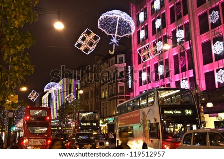 LONDON, UK-NOVEMBER 16: Shoppers are encouraged to London\'s West End to do their shopping, by the Christmas lights and department store\'s decorations along Oxford Street.November 16, 2012 in London UK