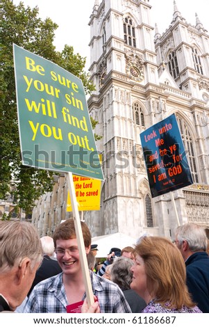 LONDON, UK-SEPTEMBER 17: Members Of The Crowd With Placards Discuss The Pope's Visit on Sept 17, 2010 in London