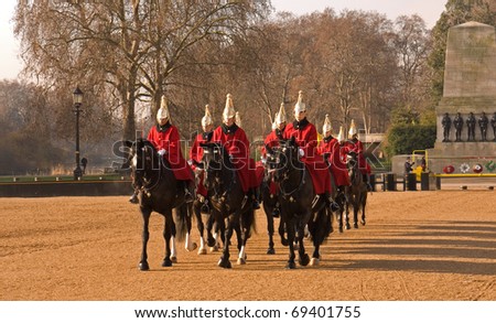 LONDON, UK- JANUARY 19: Members of the Queen\'s Royal Horse Guards, the Royal Life Guard Regiment, riding to the Changing of the Guard Ceremony in Horse Guards Parade. January 19, 2011 in London, UK.